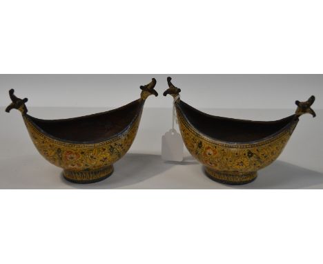 Pair of Persian enamel on metal boat shaped salts, gilt decorated and painted with birds amongst foliage, width 6.5'