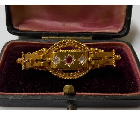 Victorian 15ct gold diamond and ruby set three stone filigree bar brooch, the two diamonds of 0.08ct spread approx, Chester 1