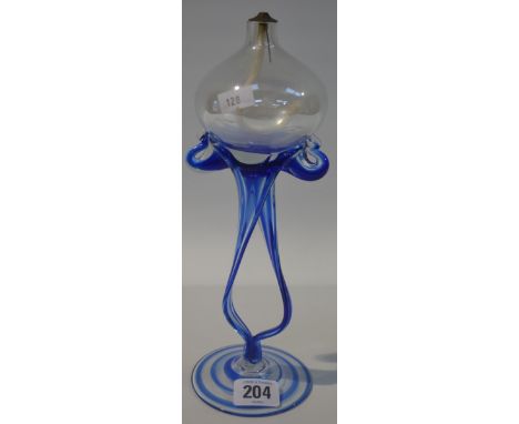 Blue and clear glass pedestal oil lamp, the ovoid well over a sinuous double pedestal and on circular foot, height 10'