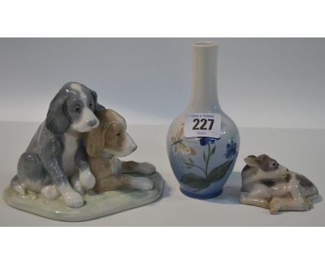 Royal Copenhagen bottle vase, together with a Bing and Grondahl model of a calf and a Lladro Nao group of two hound puppies (