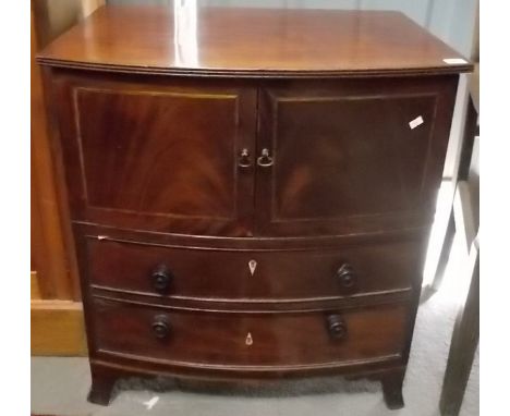 George III mahogany bow front converted commode, the reeded top over a pair of inlaid cross banded cupboard doors and 2 drawe