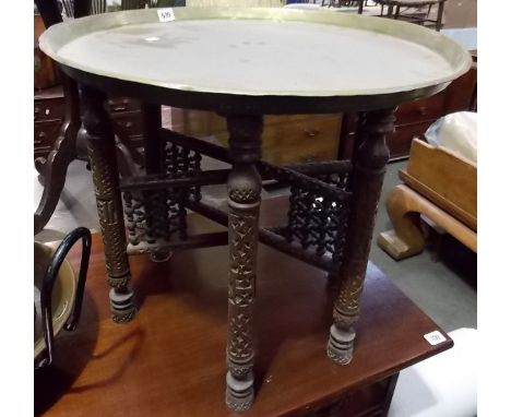 Occasional table on folding hardwood stand with bobbin trellis, diameter 22.75'.