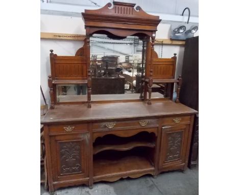 Victorian oak large mirror back sideboard, the bevel edged rectangular mirror flanked by two open shelves and panels with a m