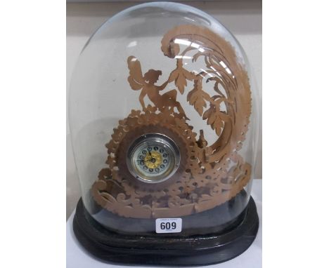 British United clock drum timepiece within a later pierced wooden frame, under an oval glass dome and ebonised stand, width o