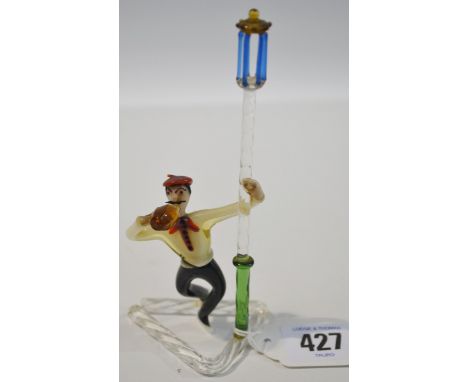 Mid-century continental glass figure of a drunk on a lamp post.