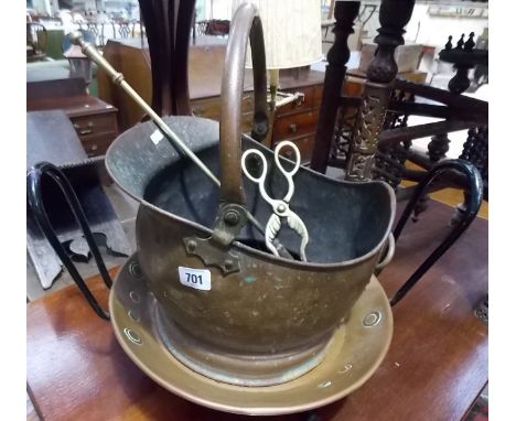 Metals including a copper coal helmet, copper dish on iron stand, brass fire poker and tongs (4).