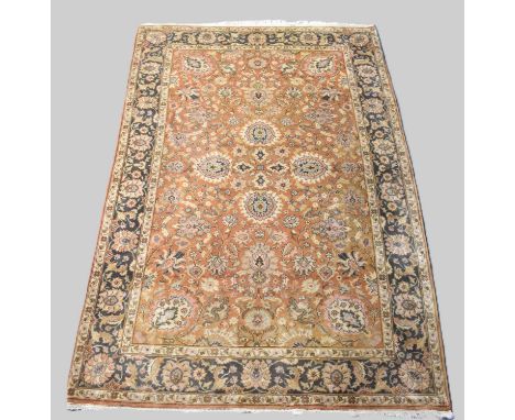 A Vintage Patterned Rug on Red Ground, 272x185cm