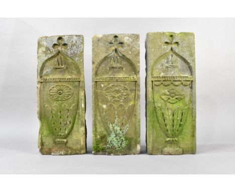 Three Weathered Carved Stone Tablets Decorated with Urns with Acanthus Based Bodies and Cross Finial, in the Ecclesiastical T