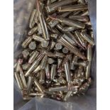 shelf of miscellaneous ammo, 12 gauge, 556, and other calibers in box