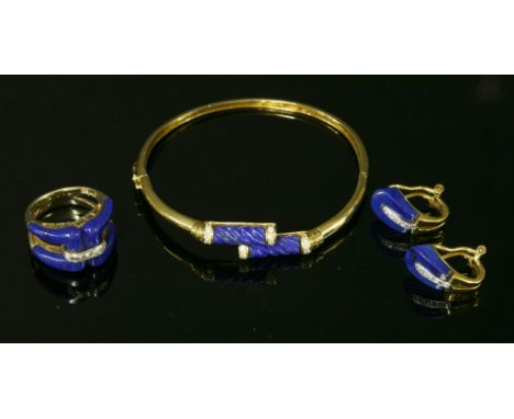 A Continental gold, lapis lazuli and diamond matched bangle, ring and earring suite,the hinged bangle with a crossover head, 