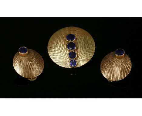 A gold sapphire brooch by Cropp and Farr, the circular clamshell form brooch with a row of four circular mixed cut sapphires,