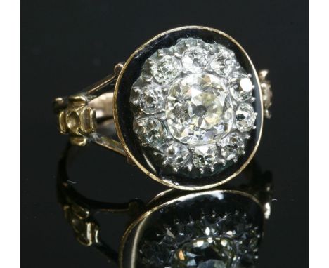 A Georgian diamond and enamel memorial ring, c.1790,a cushion cut diamond, grain set to the centre, surrounded by cushion-sha