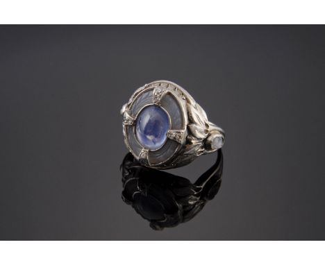 A sapphire, chalcedony, diamond and gemstone ring,probably Continental.  An oval cabochon sapphire, rub set to the centre, wi