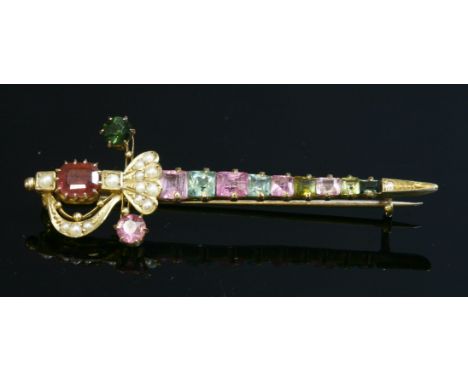A cased late Victorian gemstone and split pearl gold sword brooch, c.1900,with an octagonal step cut tourmaline, claw set at 