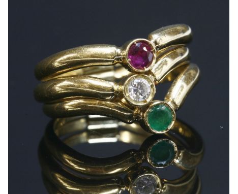 A three row, gem set, half wishbone, gold hinged ring,with a circular mixed cut ruby, a brilliant cut diamond and a circular 