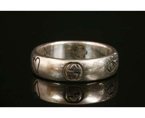 A Gucci 'Blind For Love' ring,a silver band ring engraved with 'Blind for Love'.  Italian national control mark 1968-to date,