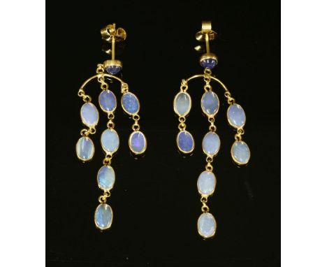 A pair of sapphire and opal girandole gold drop earrings, with a circular cabochon sapphire, rub set to the top.   An arched 