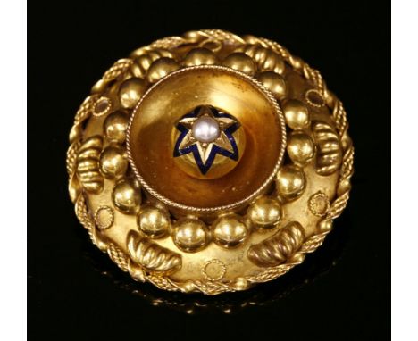 A Victorian gold shield-style brooch, c.1860,of circular form.  A raised central boss with a split pearl to a blue enamel sta