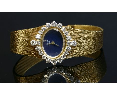 A ladies' 18ct gold Topaz London mechanical diamond set bracelet watch, c.1970,an oval black lacquer landscape dial, with gil