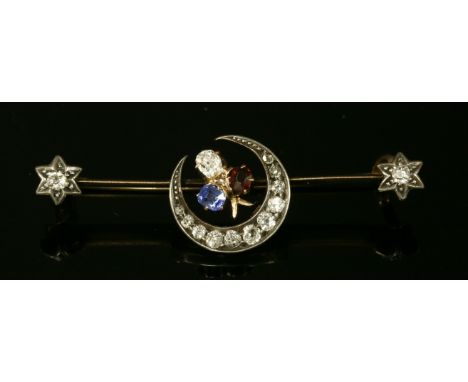 A Victorian ruby, sapphire and diamond crescent and star brooch, c.1890,with a cushion-shaped old star cut sapphire, ruby and