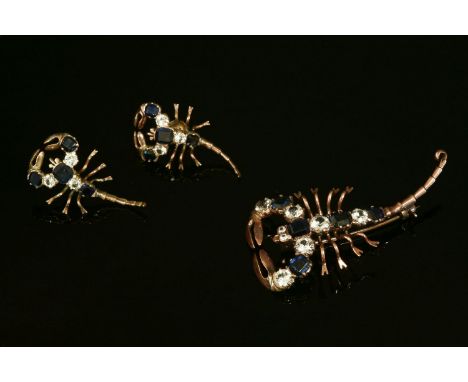 A gold, sapphire and white synthetic sapphire scorpion brooch, with matching earrings,alternating sapphire and white syntheti