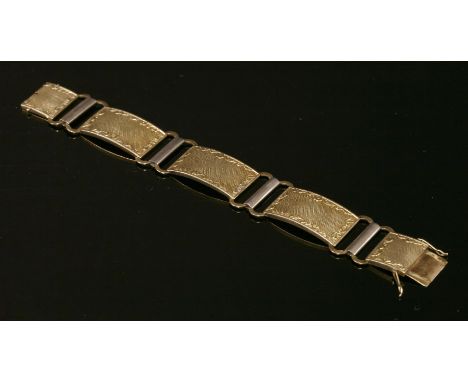 A Continental Art Deco two colour gold hollow plaque link bracelet,with a series of hollow curved rectangular plaques.  Each 