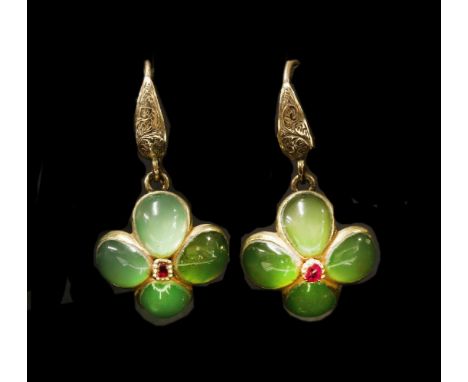A pair of ruby and chrysoprase cluster drop earrings,with a faceted ruby, grain set to the centre.  A quatrefoil cluster of p