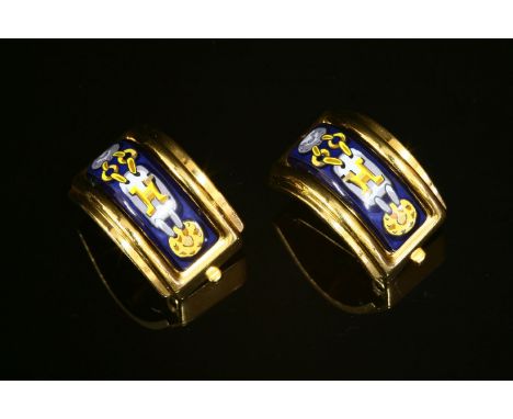 A pair of Hermès gold-plated enamel cuff earrings, navy enamel to the centre with a printed design, to a stepped polished bor