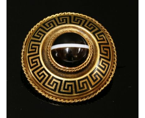 A late Victorian gold, banded agate and enamel memorial brooch of shield form,a circular cabochon banded agate, rub set to th