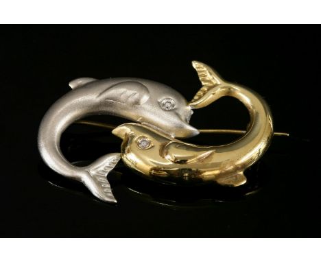 A Continental two colour gold dolphin brooch,with a polished yellow and sandblast white dolphin, positioned head to tail with