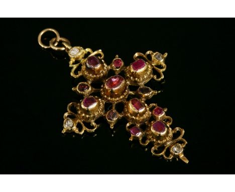 An Iberian gold, ruby and diamond set cross,with graduated foiled rubies rub set to plain collets, with a notched border.  Ro