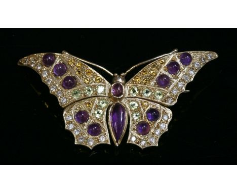 A gem set gold butterfly brooch,with a pear-shaped cabochon amethyst abdomen and oval cabochon thorax, all rub set in plain c