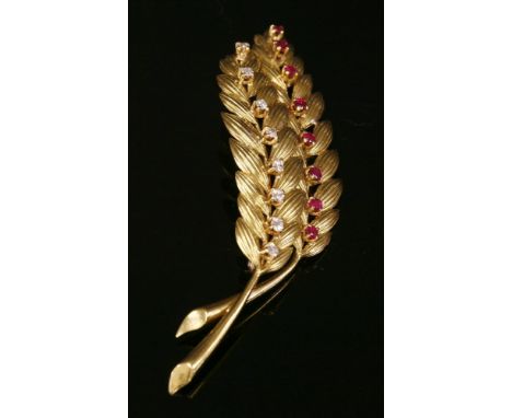 A gold, ruby and diamond ears of wheat brooch,with two wheat ears with incised decoration.  A row of Swiss cut diamonds, all 
