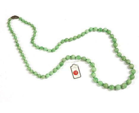 A single row graduated jade bead necklace, 5 - 8.5mm, strung knotted to a marcasite clasp, 51.82g