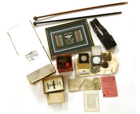 A collection of First and Second World War military related items, to include two swagger sticks,  a First World War sketchbo