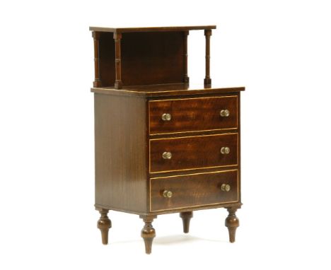 A mahogany and boxwood strung bedside chest, the top with a shelf raised on turned supports over three drawers