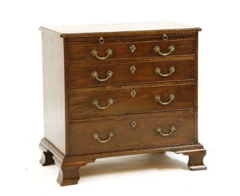A George III mahogany chest of four graduated drawers, below a brushing slide, all raised on bracket feet, 75cm wide