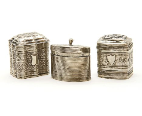 A Dutch silver box, of oval reeded form, with a stud finial to the hinged cover 3.5cm high and two further silver boxes,each 