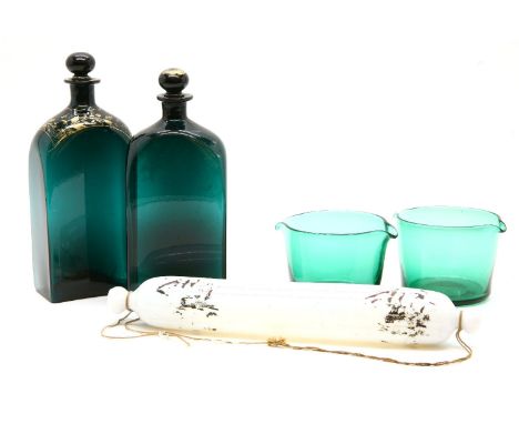 Two green glass decanters, 26.5cm a pair of rinsers and a rolling pin