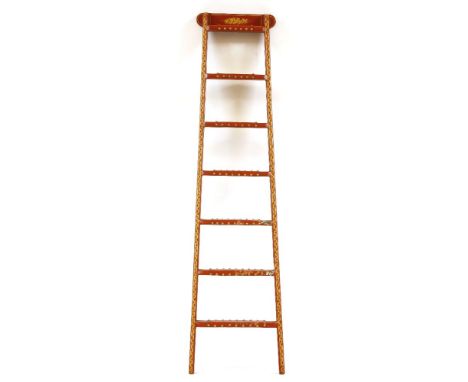 A modern library ladder, with red painted and gilt decoration and red leather treads, 158cm high