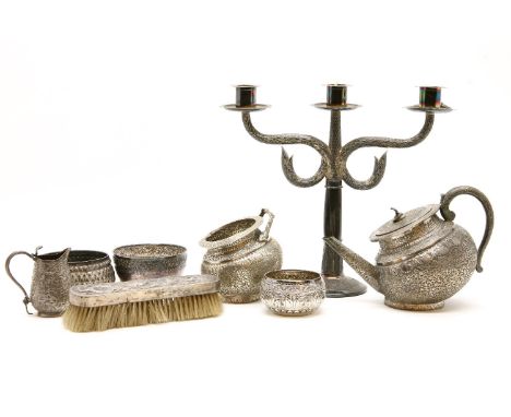 A late 19th to early 20th century Indian Kashmir silver teapot, of Kang form with cobra finial together with a matched sugar 