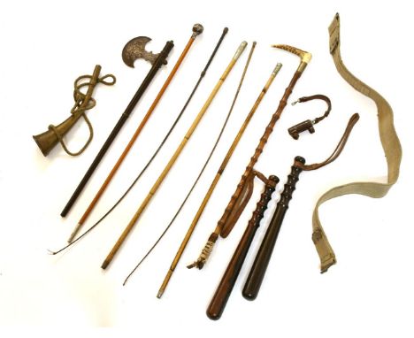 An Indian axe, brass horn, two truncheons, etc