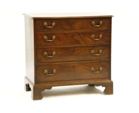 A George III mahogany chest of four graduated drawers, with brass drop handles, raised on bracket feet, 85cm wide