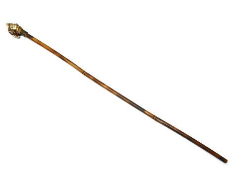 A bamboo swordstick, with carved finial in the form of a cavalier, 105 cm high