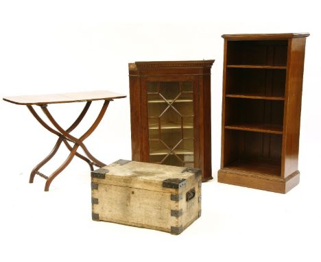 A mahogany folding table, together with a mahogany open bookcase, a glazed corner cupboard, and a trunk
