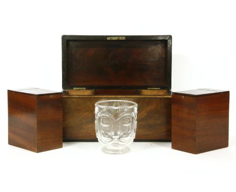 A late George III mahogany and ebony strung tea caddy, the rectangular top enclosing twin canisters and cut glass mixing bowl