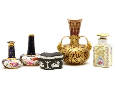A Derby twin-handled vase, decorated in gilt with birds and insects amongst foliage, on a red ground, together with two Derby
