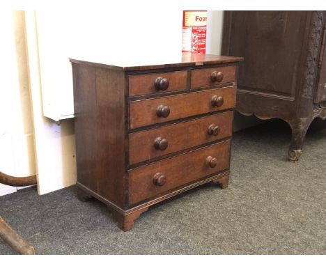 An oak five drawer graduated chest, with mahogany fronts, ebony strung drawers, on bracket feet, with shells in the drawers, 