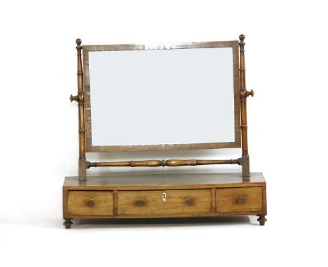A George III mahogany toilet mirror, fitted three base drawers