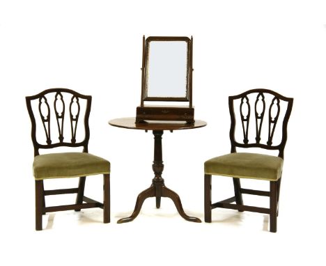 A George III mahogany tilt-top tea table on tripod base, 70cm diameter, together with a pair of mahogany chairs with shaped b